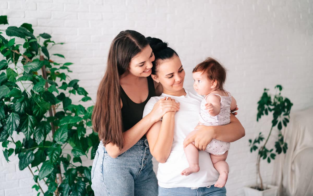 Two,Beautiful,Young,Women,In,Casual,Clothes,Hug,And,Look
